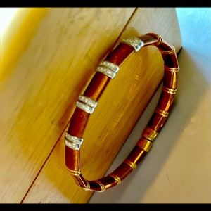 Modern Henderson bracelet chocolate gold with bands of diamonds. Bangle